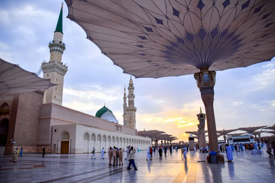 Scenic view of Al-Masjid an-Nabawi with open umbrellas and pilgrims